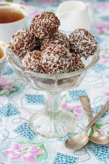 Homemade healthy vegan chocolate candy with coconut and banana