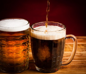 Drink. two glasses beer red background!
