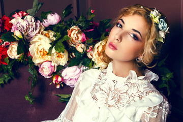 Young bride on a couch with flowers