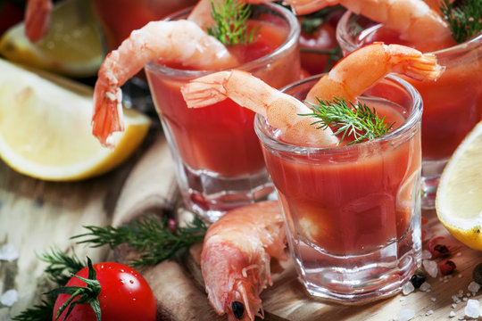 Seafood appetizer: shrimp with tomato sauce, herbs and spices, s