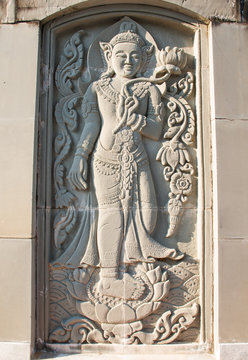 Carved sandstone Buddha image.