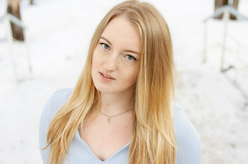 beautiful young girl with blondy hair in blue dress