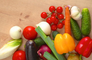 Pile of organic vegetables on a wooden table