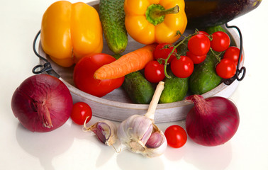 Fresh autumn vegetables on a white background