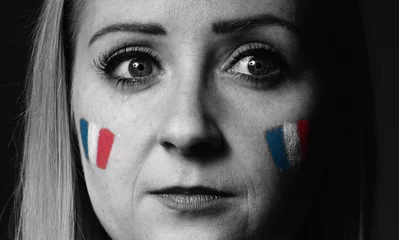 Foto op Canvas Sad, crying woman in the national colors of France. © itsmejust