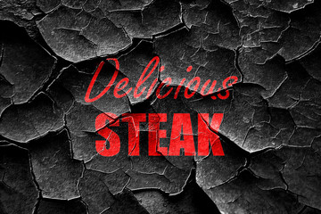Grunge cracked Delicious steak sign