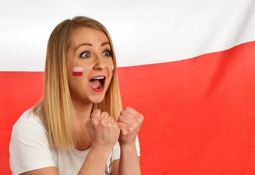 Polish Fan Cheers Football Team In The National Colors.