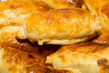 Beautiful, red-cheeked, golden pastries - croissants and puff pa