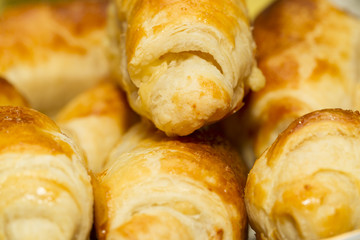Beautiful, red-cheeked, golden pastries - croissants and puff pa