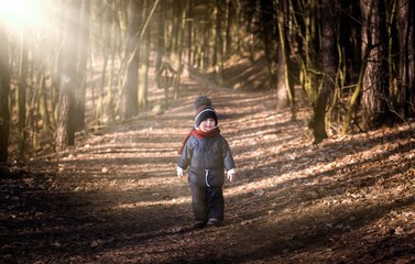 Caucasian boy playing outdoor at springtime