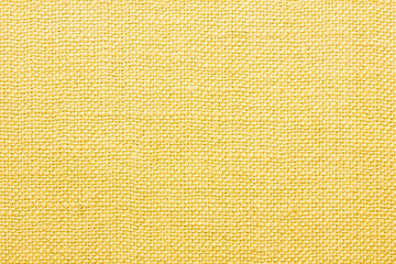 Yellow linen fabric closeup texture.