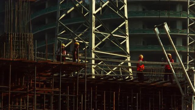 Time Lapse shot of manual workers working at a construction site