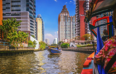 River boat transporting passengers and tourist down Chao Praya river , Bangkok , Thailand 