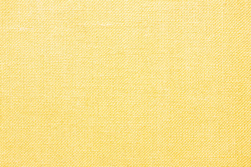 Yellow linen fabric closeup texture.