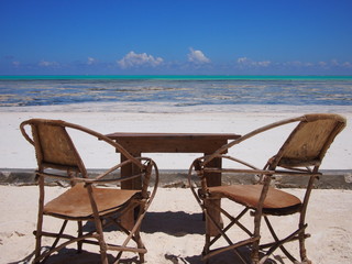 Empty chairs on tropical Indian Ocean beach