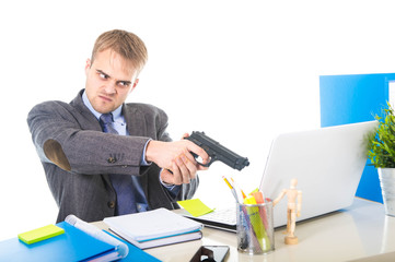overwhelmed businessman in upset face expression holding gun pointing computer