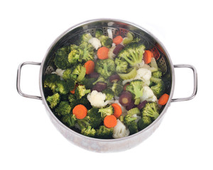 Steam cooked vegetables on stainless steel steamer