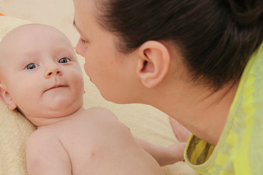 Mother enjoy playing with her five months  baby boy