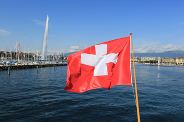 Swiss flag over lake Geneva