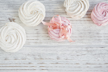 Homemade sweet pink and white marshmallow - zephyr on a light wo