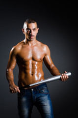 Ripped man with baseball bat