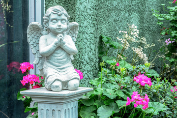 Beautiful statue of the angel praying in the park
