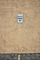 Employee Parking Sign in Empty Parking Spot