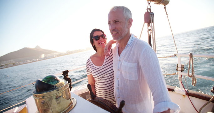 Senior couple enjoying a yacht cruise together