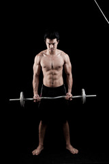 Muscular Asian man  with barbell