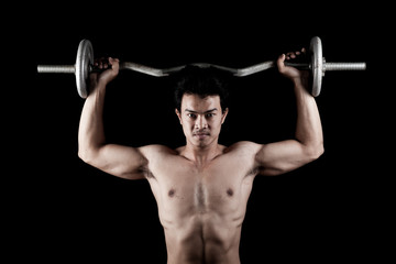 Fototapeta na wymiar Muscular Asian man with barbell