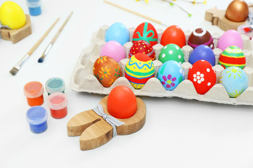 Colorful Easter eggs on white table closeup