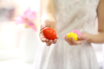 Female hands holding Easter eggs