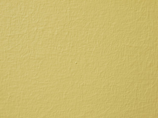 Yellow concrete wall background