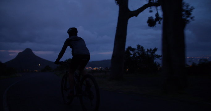 Low angle cropped shot of unrecognizable cyclist riding his bicycle