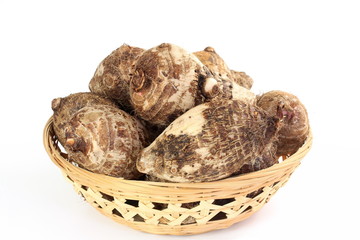 Taro root or eddoes root isolated on white background