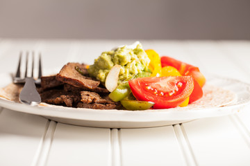 Side view of fresh homemade steak fajitas