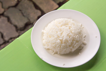 cooked rice in white plate.