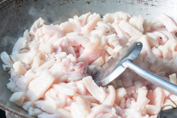 Pork skin in pan for making lard , Selective focus on center of