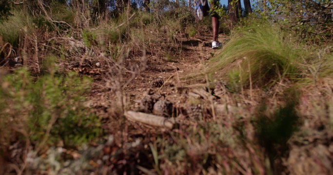 Close up of runner's running shoes on trail run