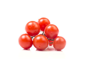 Slide bright juicy tomatoes with drops