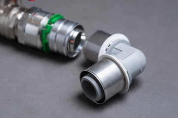 Water valves with fittings on grey