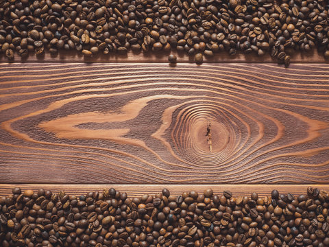 Multiply coffee beans on the wooden table. Top view