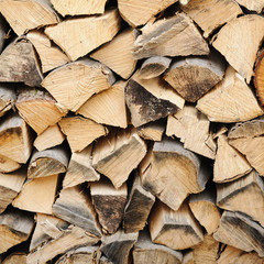 Stack of firewood. chopped wood stacked background 