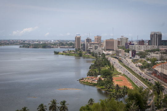 Abidjan, the economical capital of Ivory Coast (Cote d'Ivoire), it's business area Plateau with the Atlantic ocean bay in the background. April 2013