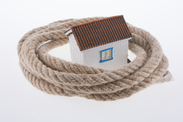 house surrounded by rope
