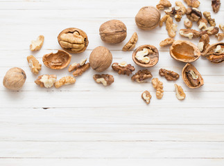 walnuts on white wooden background