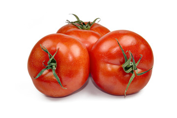 Red fresh tomatoes isolated on white background