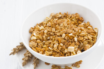 homemade baked muesli in bowl, closeup