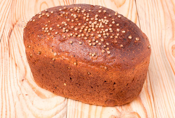 Black bread with fresh coriander closeup