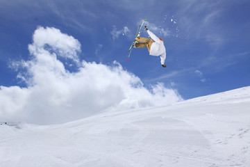 Naklejka na ściany i meble Ski jump on mountains. Extreme winter sport.